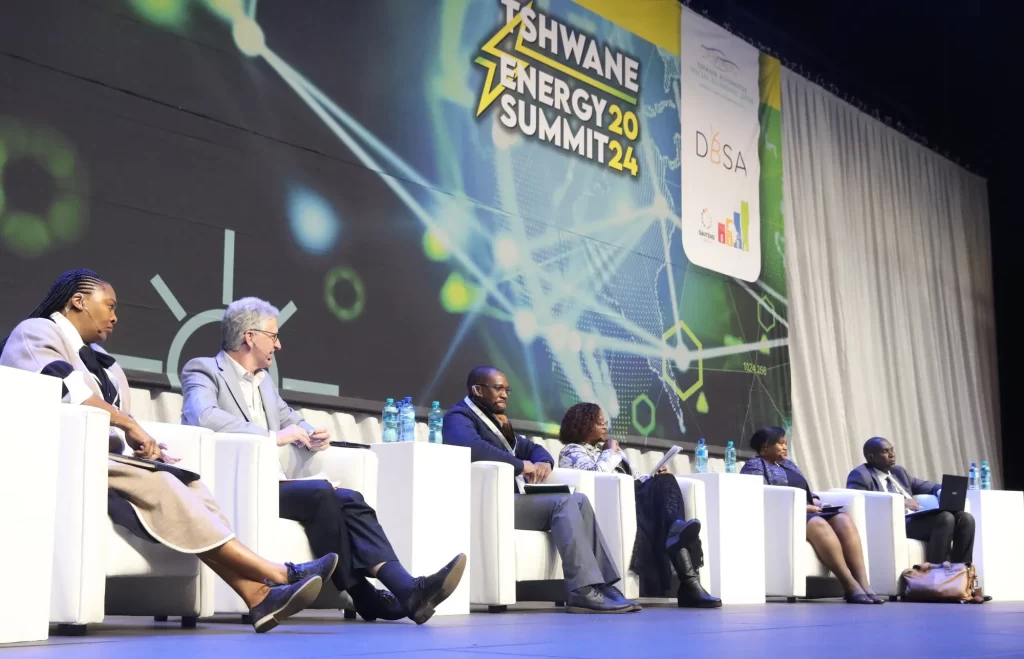 Panel discussion at Tswane Energy Summit 2024 with six speakers seated on stage